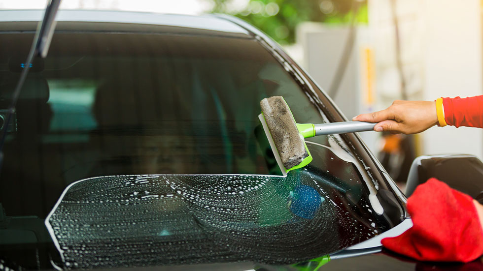 car windshield being squeegeed