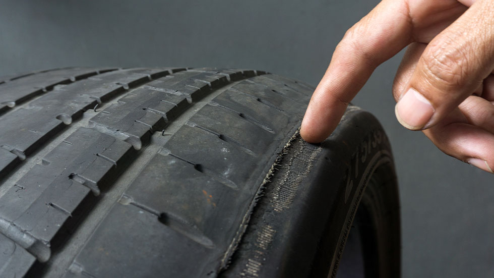 pointing out tire damage