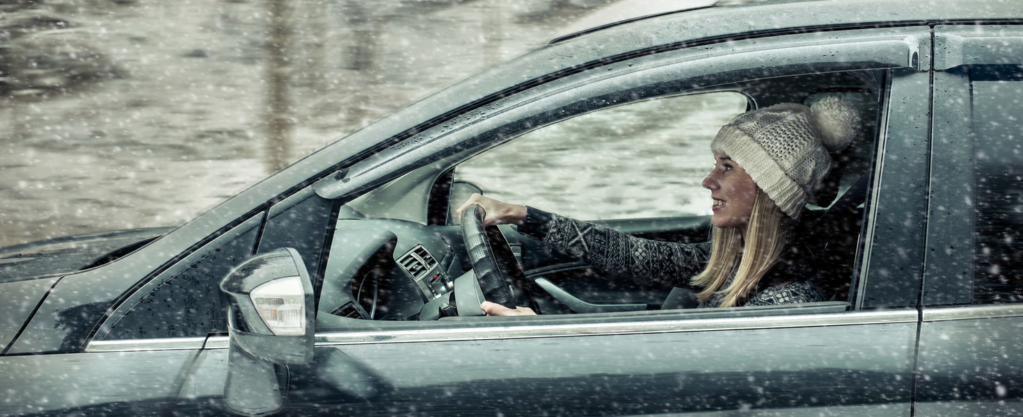 Woman driving in snow