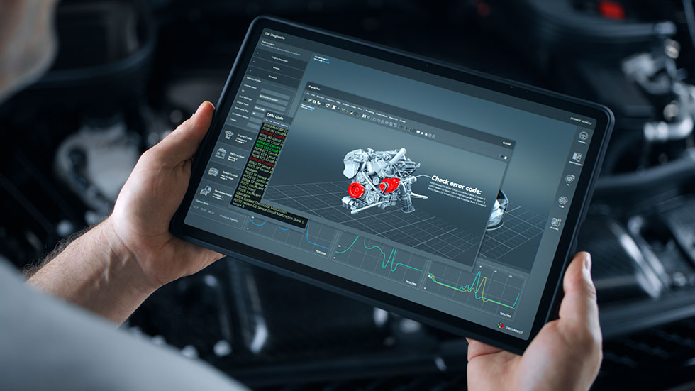 A car repairman performs wireless diagnostics of a car