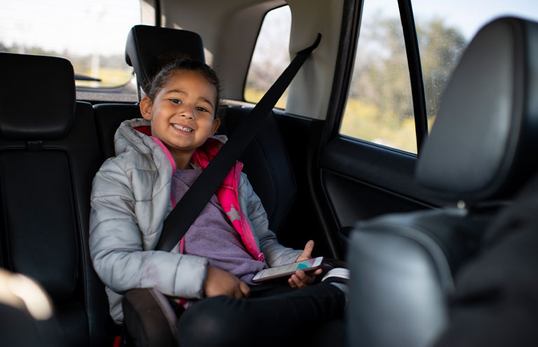 little girl in car seat
