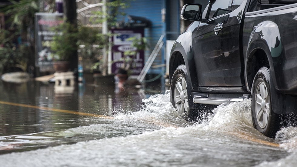 Truck driving through flood water