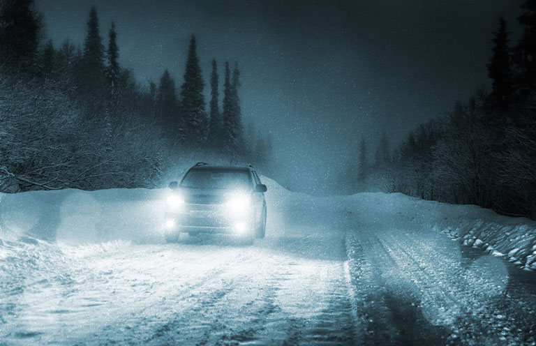 car at night in snow