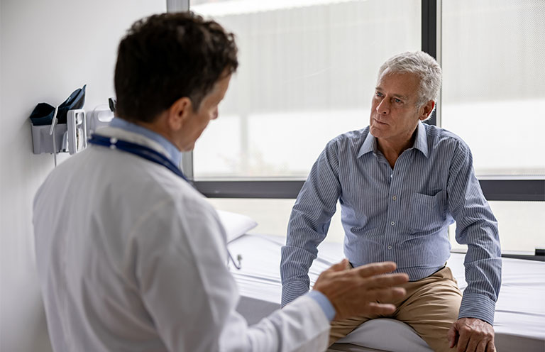 Doctor talking to a patient in a consultaton at the office