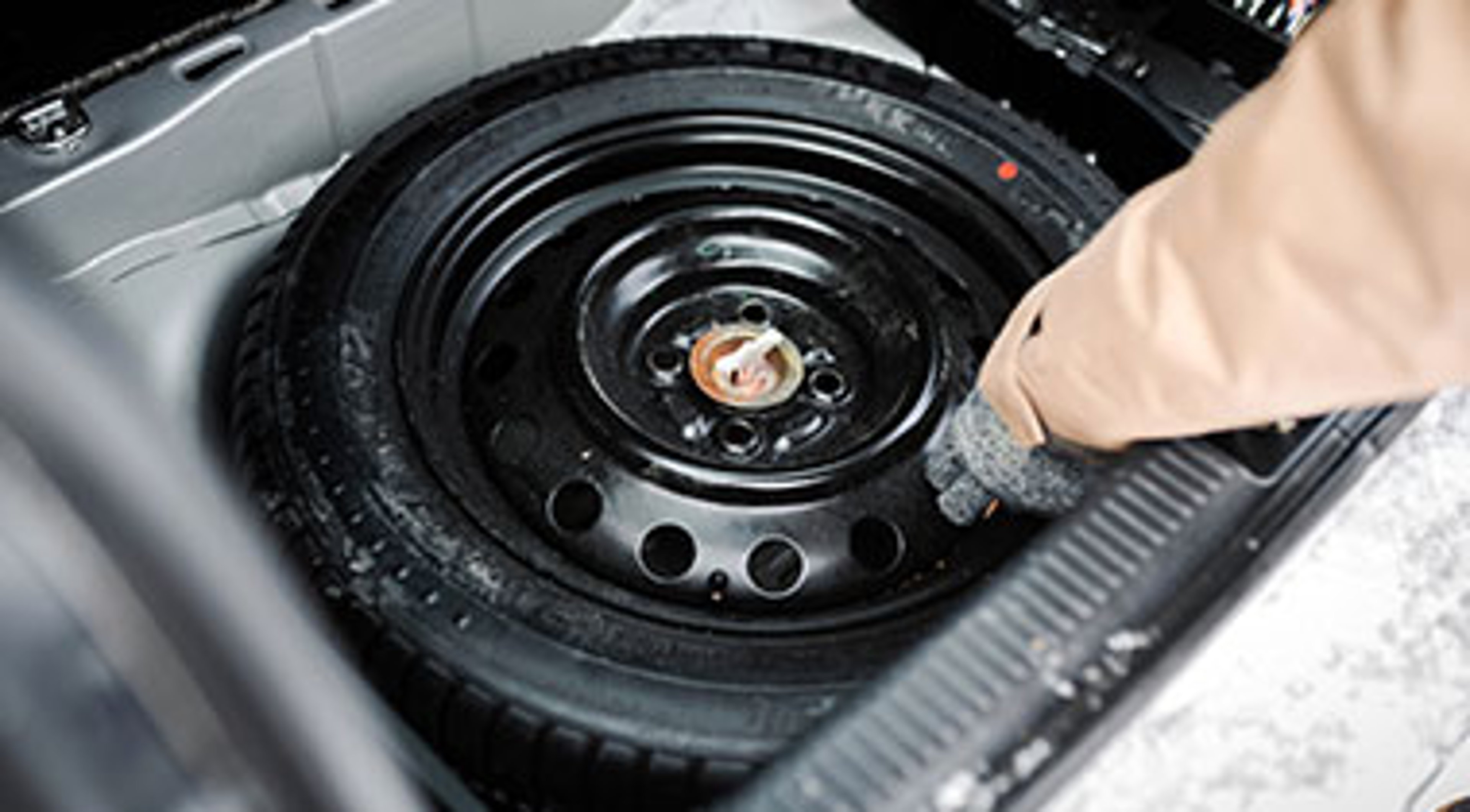 Getting a spare tire out the car