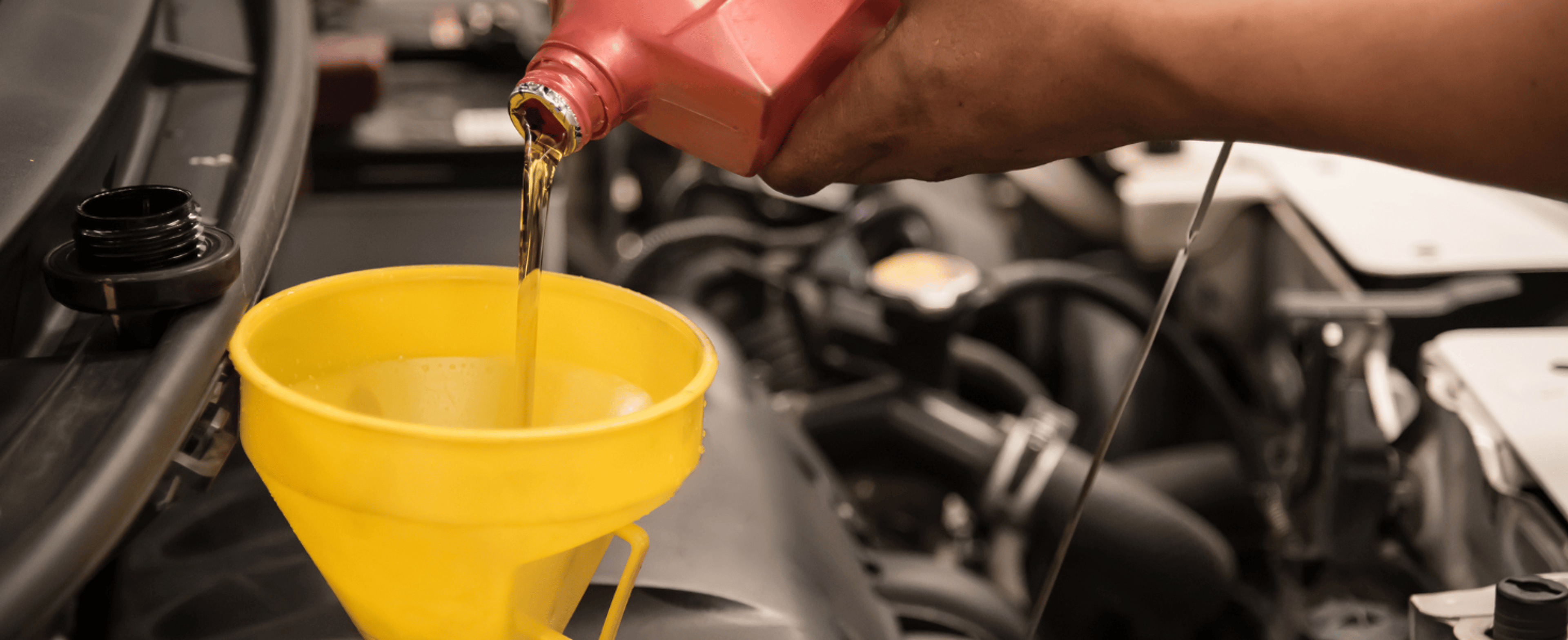motor oil being funneled 