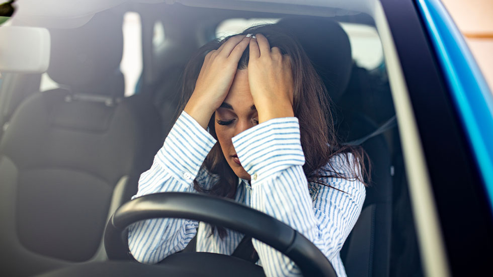 woman upset in car