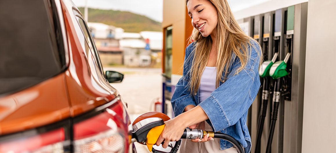 woman pumping gas