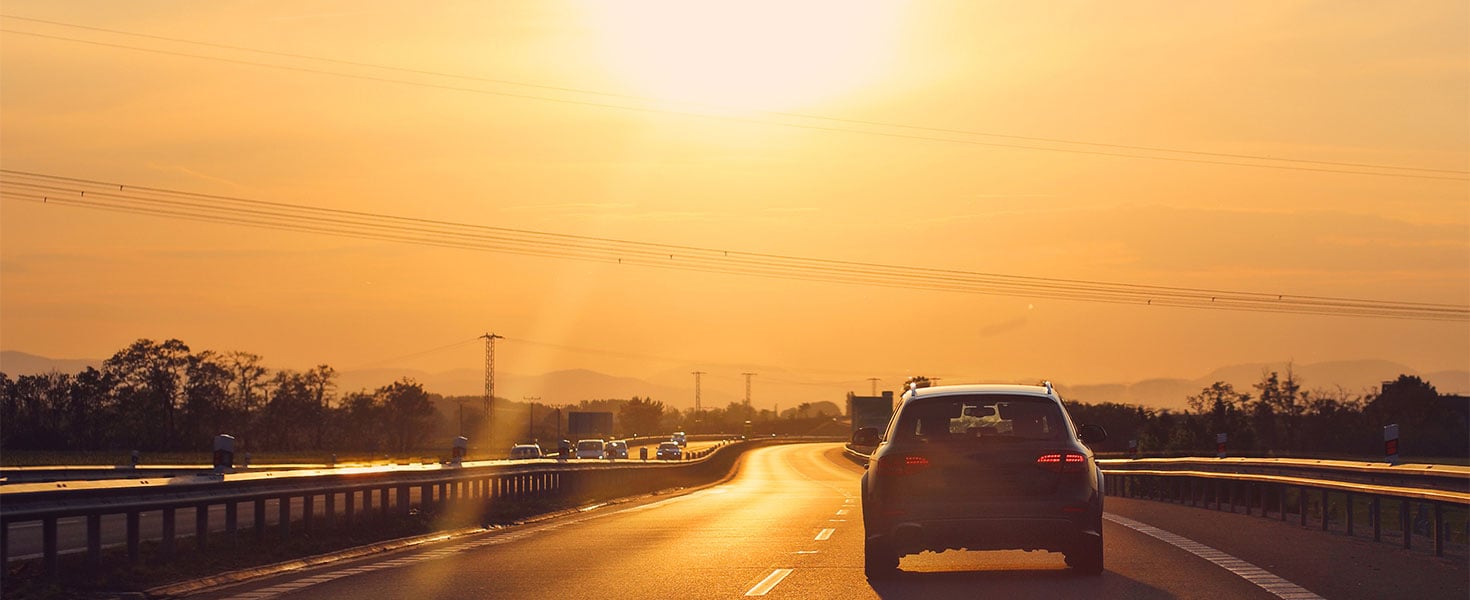 car driving in bright sunlight