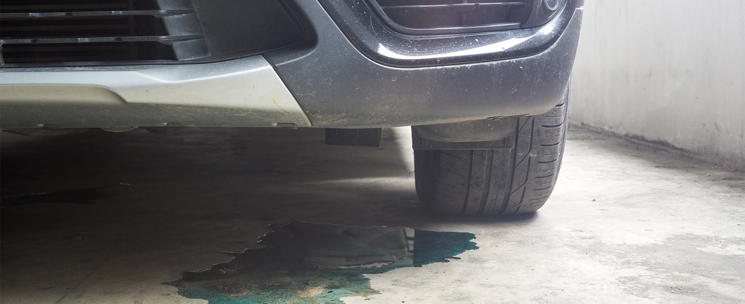 Bottom of car leaking blue fluid