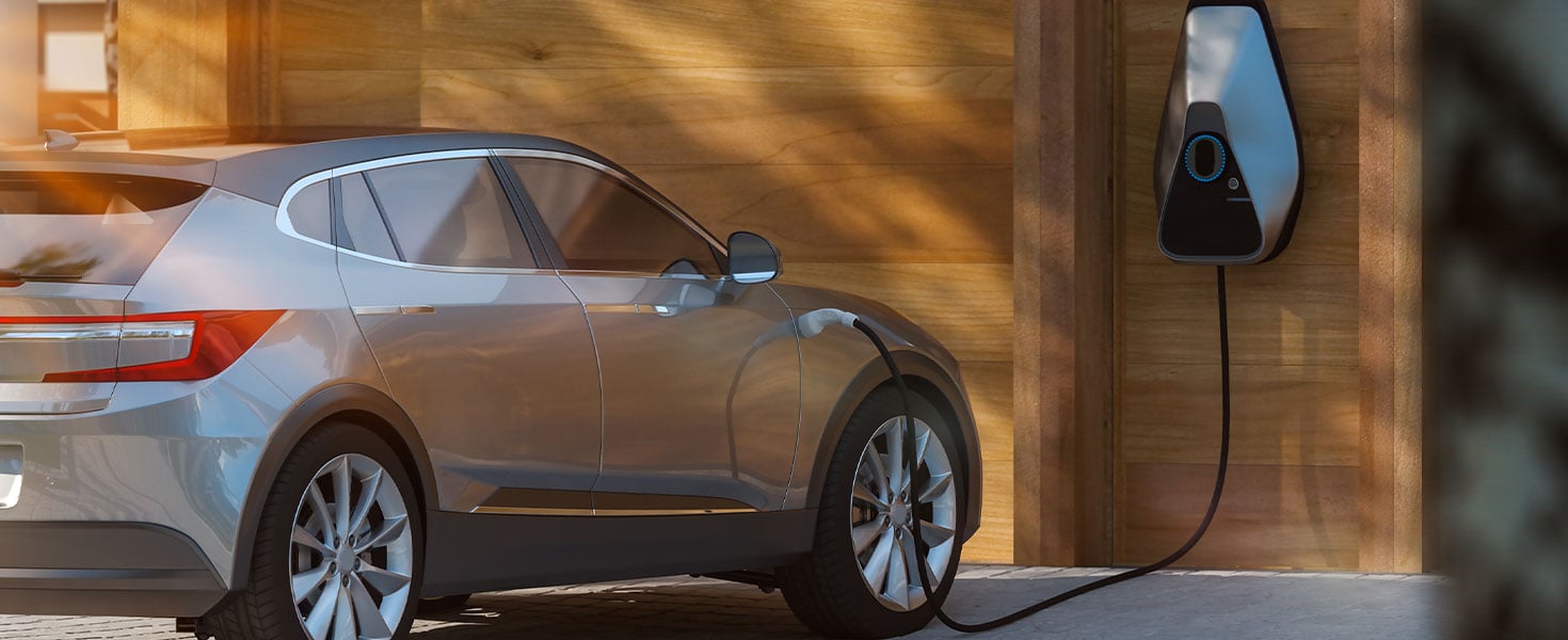 electric car being charged at house