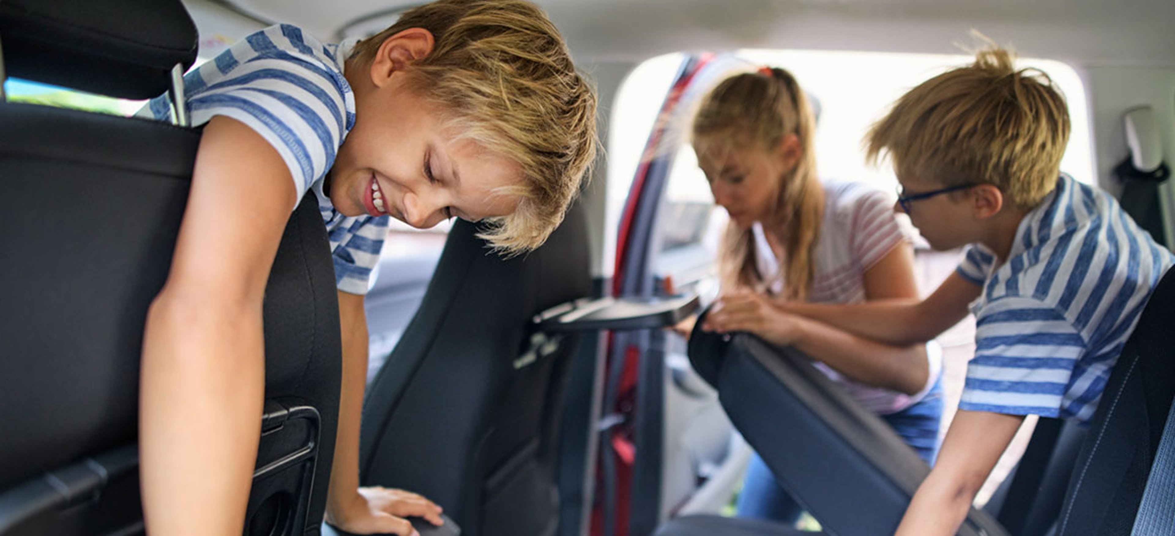 Kids helping to clean car
