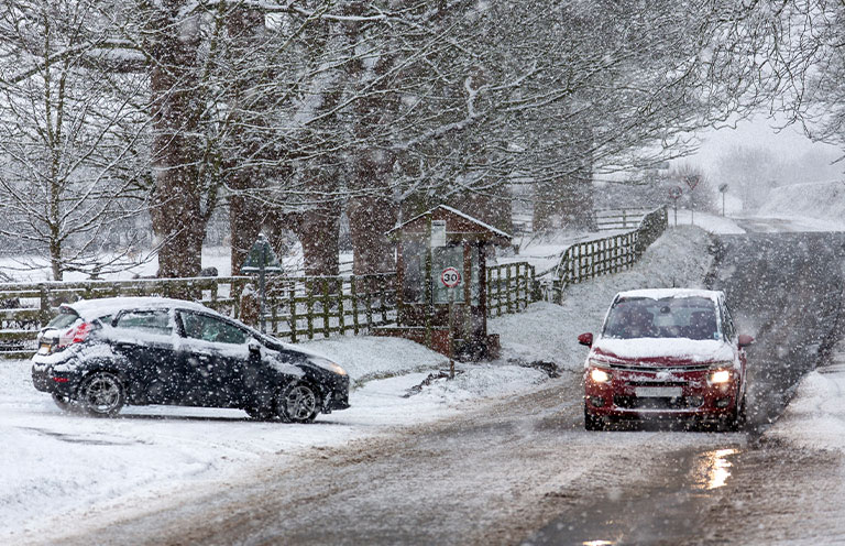 two cars on the snowy road 