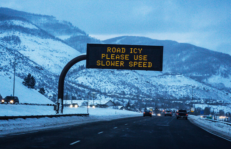 icy road warning sign