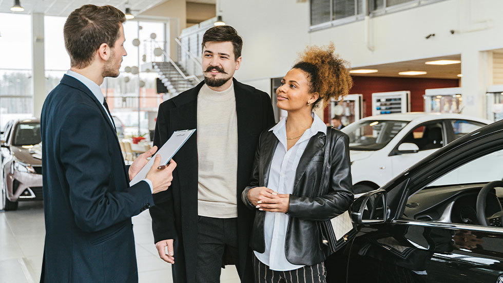 couple at car dealership