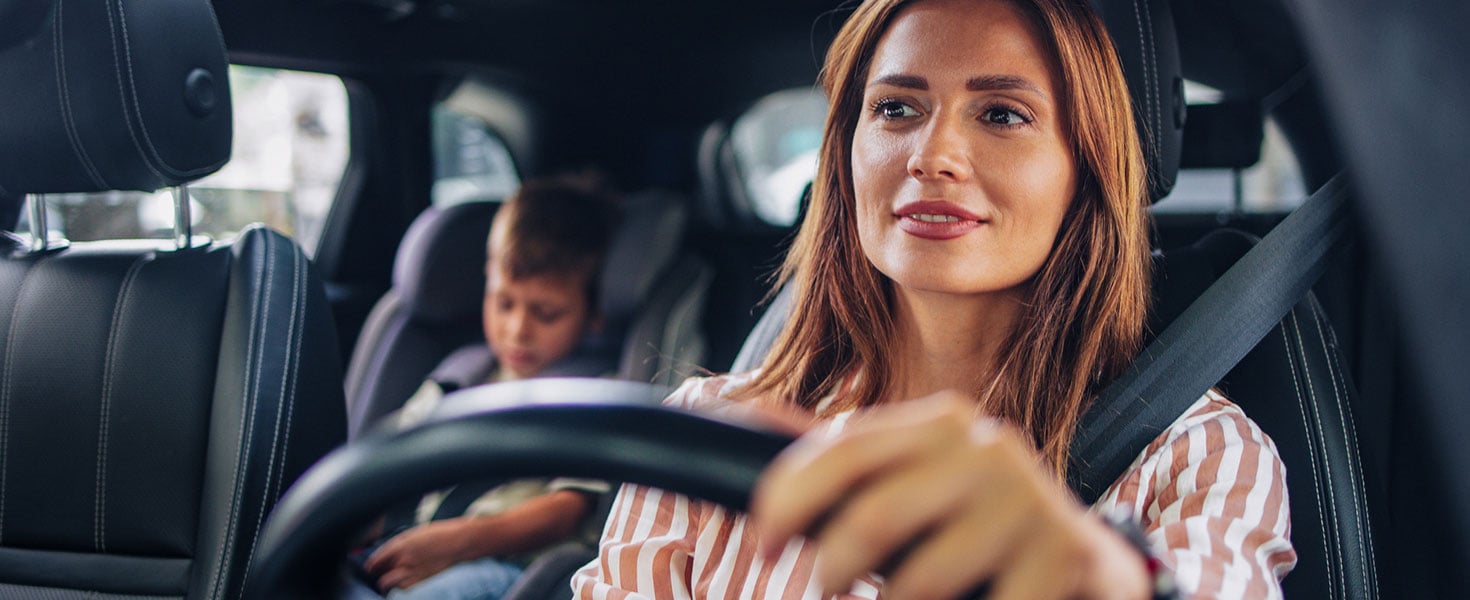 Mom Driving Son to School in Car for Back to School Season. Credit: miniseries