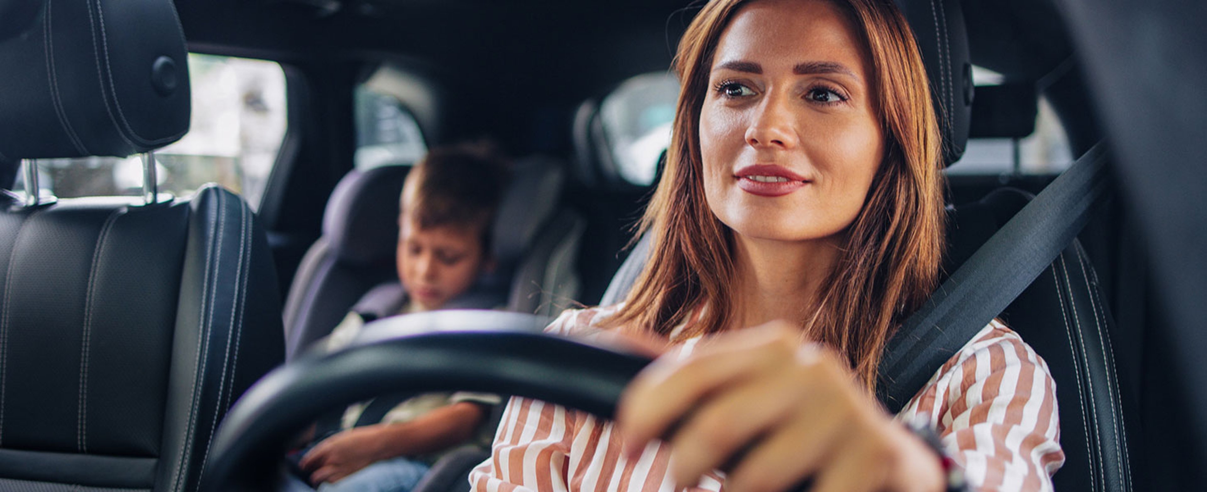 Mom Driving Son to School in Car for Back to School Season. Credit: miniseries