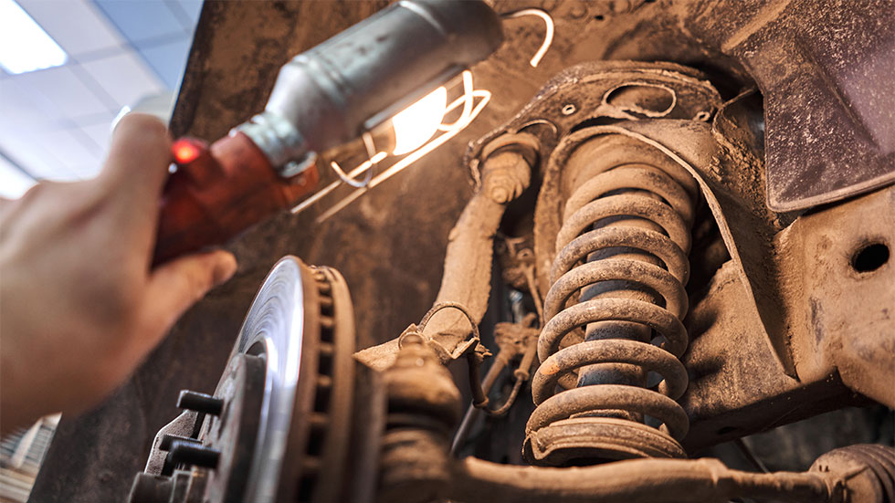 using light to look at car suspension 