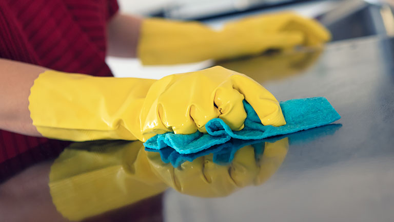 Wiping the kitchen counter by Marcus Lindstrom