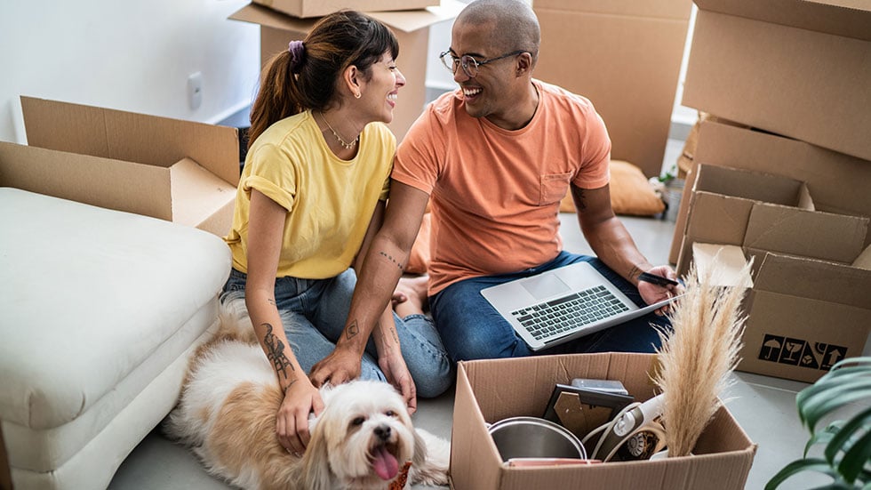 Couple unpacking with kids