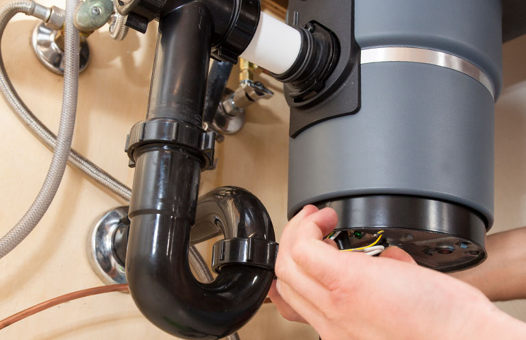 new garbage disposal being installed
