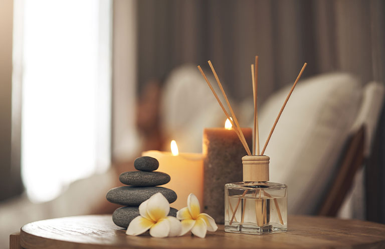 incense, candles, flower on table