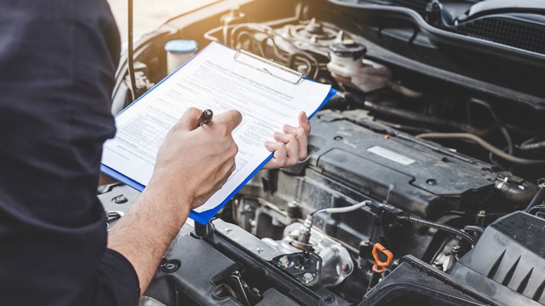 Services car engine machine concept, Automobile mechanic repairman checking a car engine with inspecting writing to the clipboard the checklist for repair machine, car service and maintenance; by Freedomz