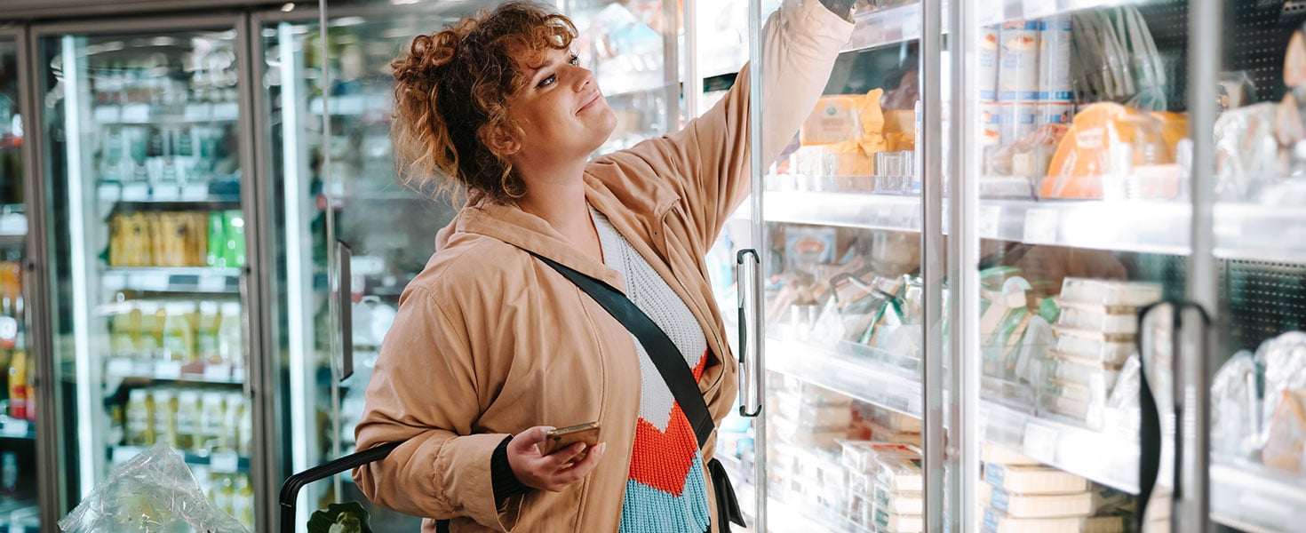 Woman shopping groceries by Jacob Lund