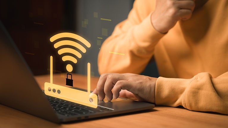 Cybersecurity and WiFi protection concept. WiFi router with a lock symbol appears above a laptop, representing secure internet connection, online privacy, network protection and safe browsing