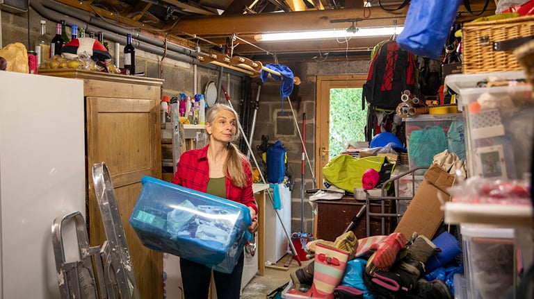 A mature woman springs into action whilst stuck at home because of the Coronavirus pandemic and decides to sort out her garage whilst in lockdown.  Credit: SolStock