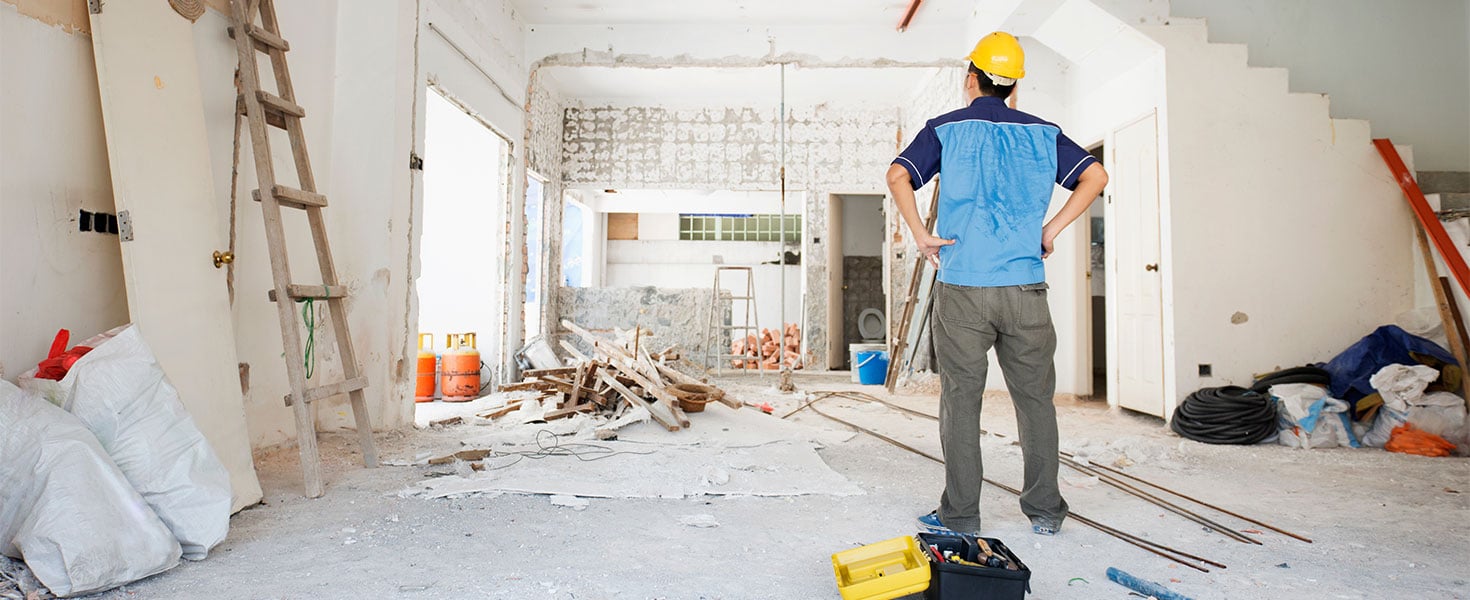 contractor standing in room that is being renovated