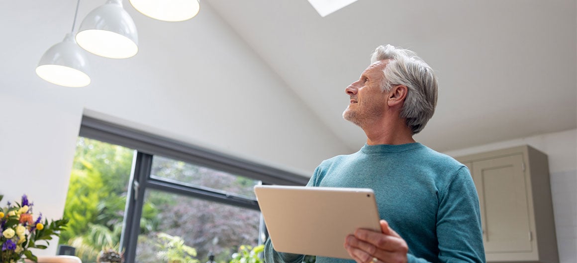 Man using new technogy to turn on lights