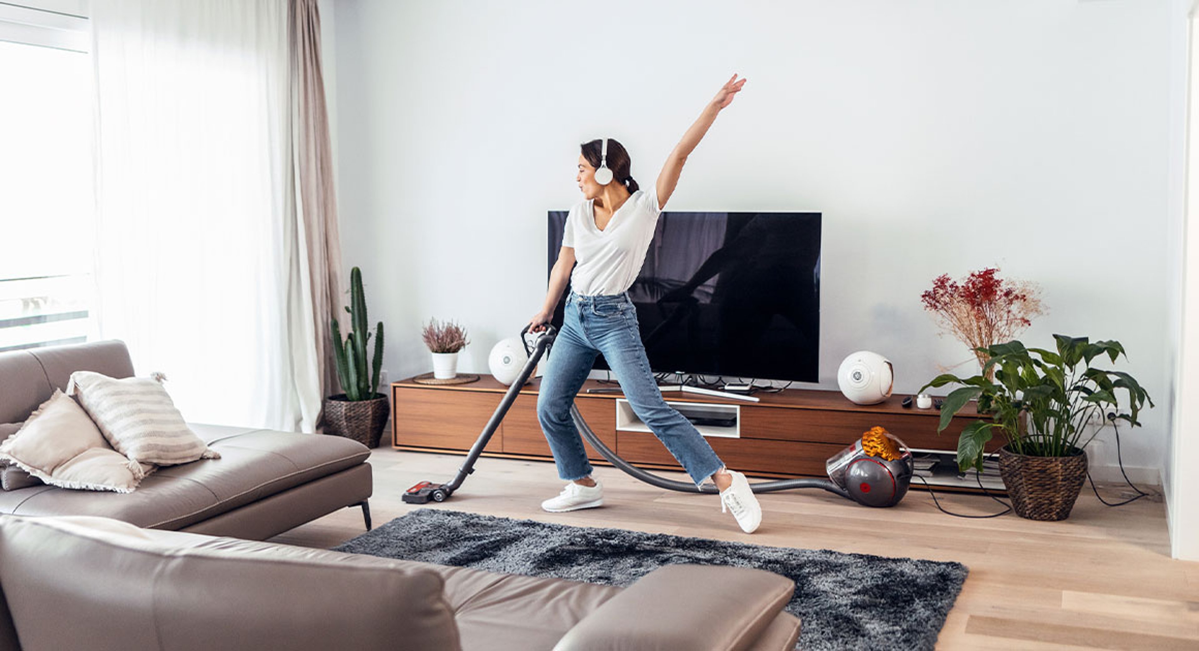 Woman cleaning floors and happy