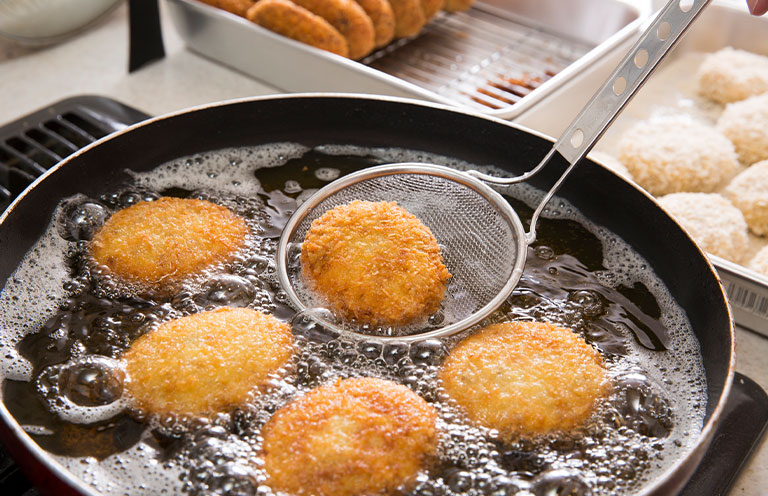food being fried in pan