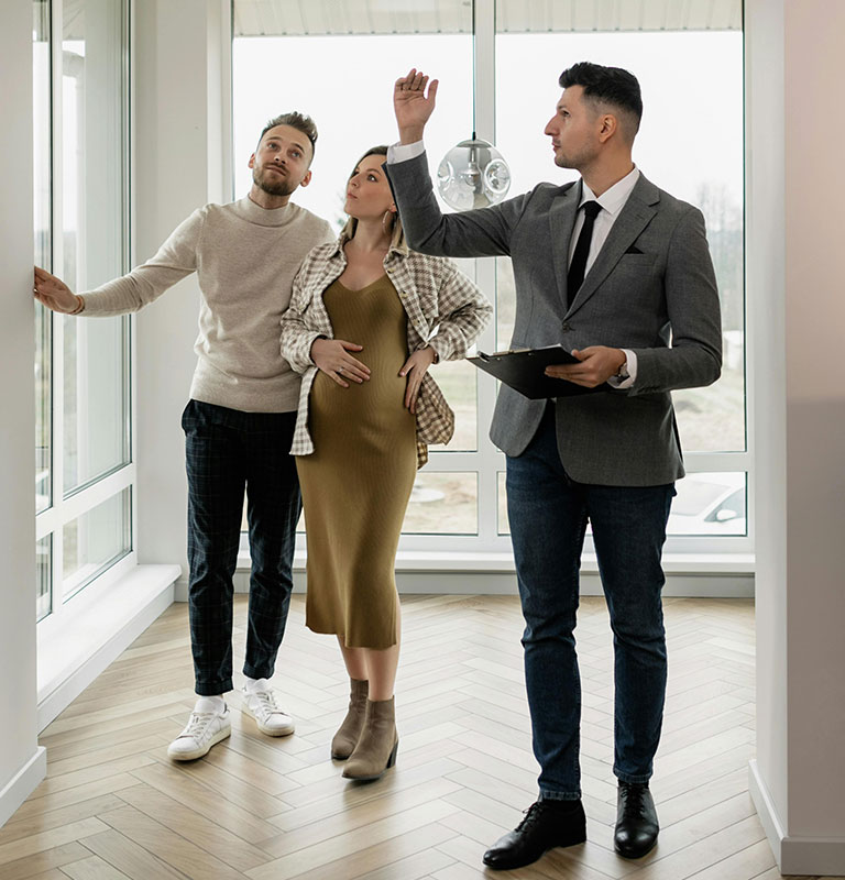 Real Estate Agent Showing Property to a Couple Credit: Alena Darmel with Pexels