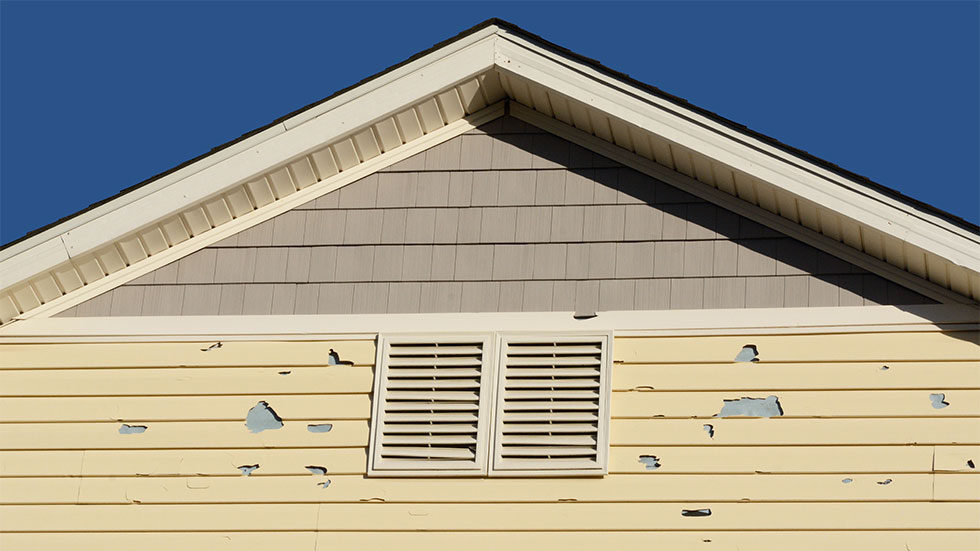 Hail damage on house siding