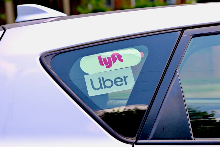Lyft and Uber Stickers Inside Car