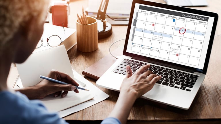 woman looking at calendar with circled date