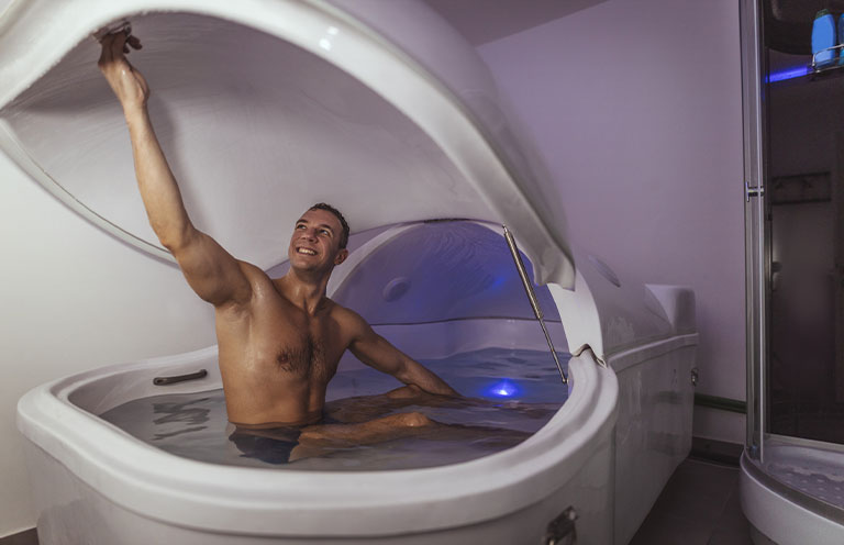 man is preparing for floating in a sensory deprivation tank