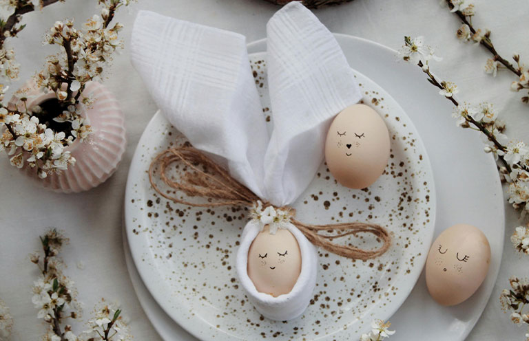 eggs decorated with faces drawn on it