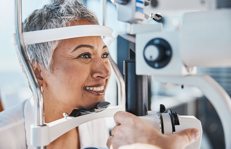woman getting eyes examined