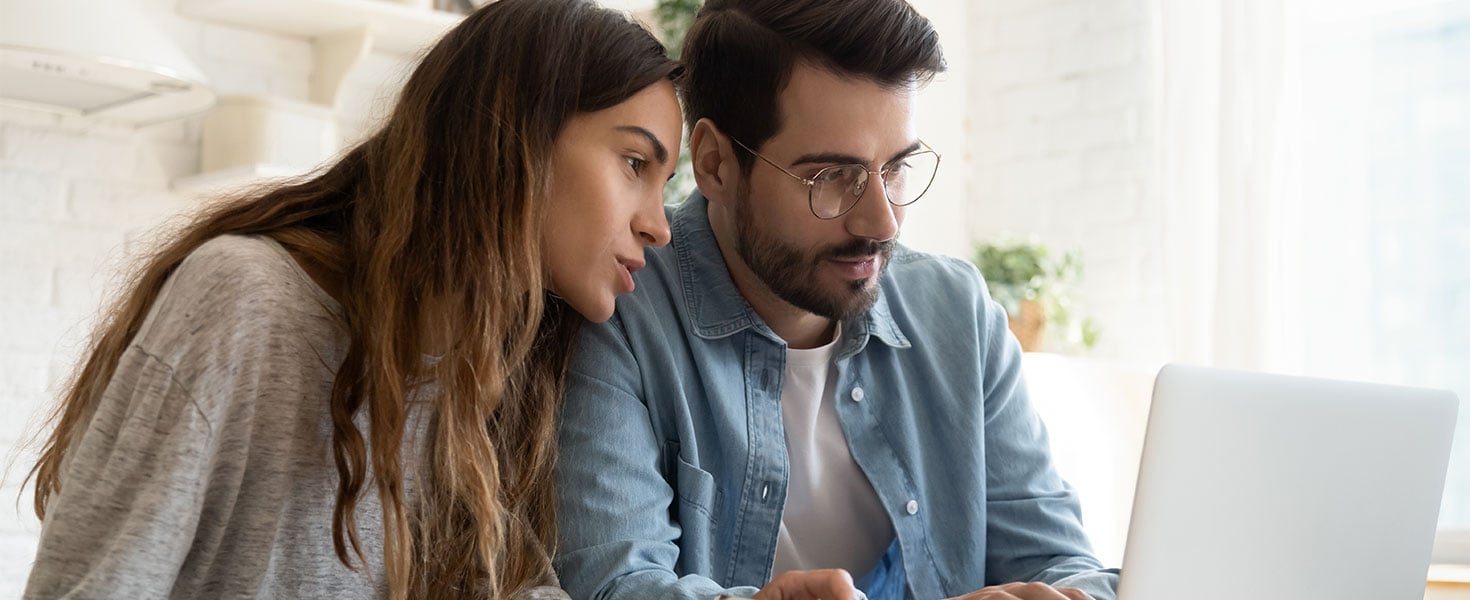 couple looking at laptop