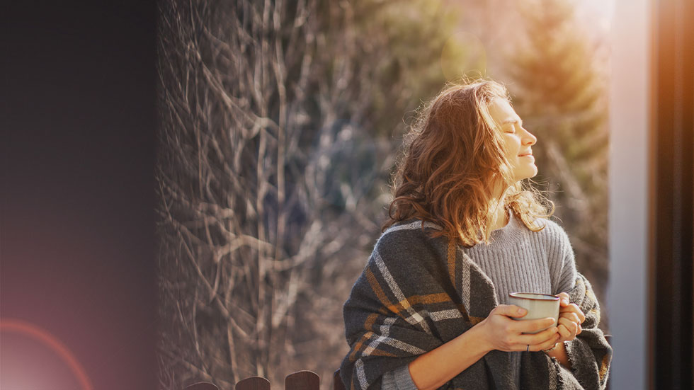 woman standing in sunlight