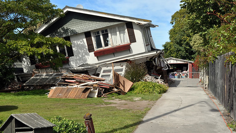 Earthquake - Lower storey of house collapses. By NigelSpiers