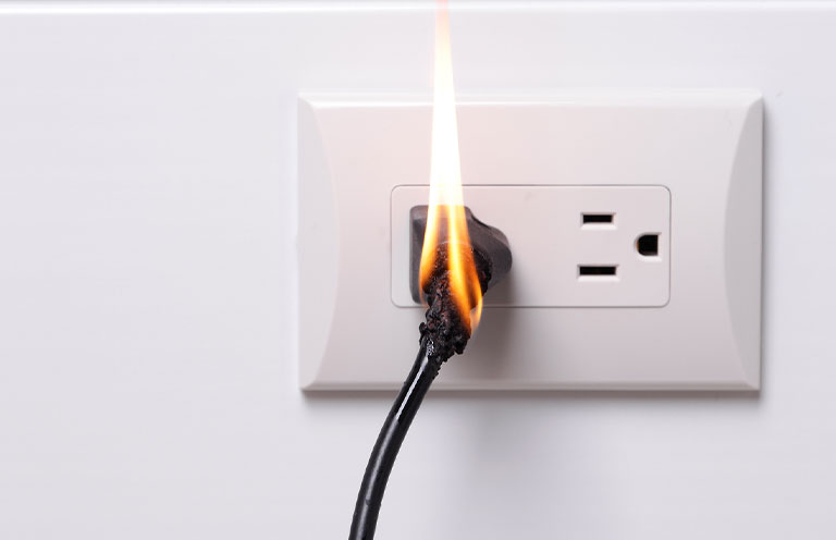 plug caught on fire in outlet