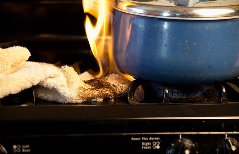 towel caught on fire from burner on the stove