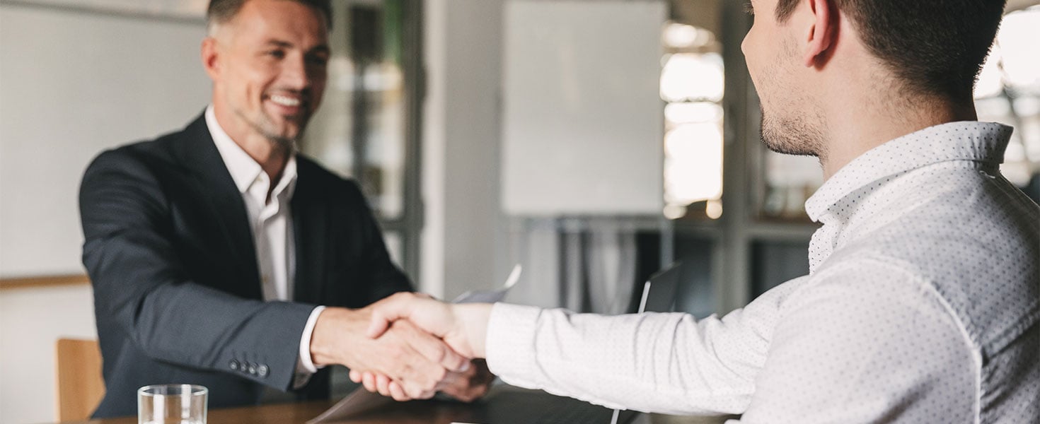 Men shaking hands during interview