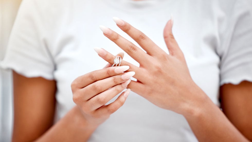 woman taking off ring