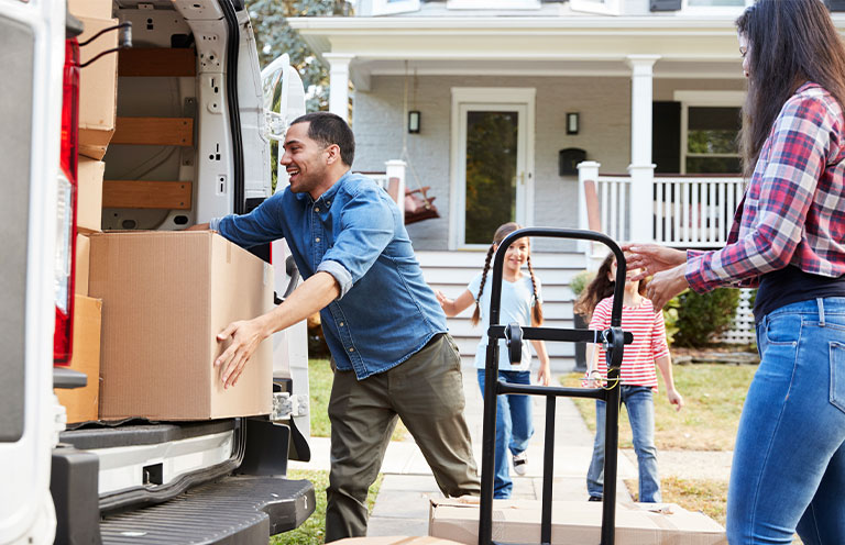 family moving items into moving truck