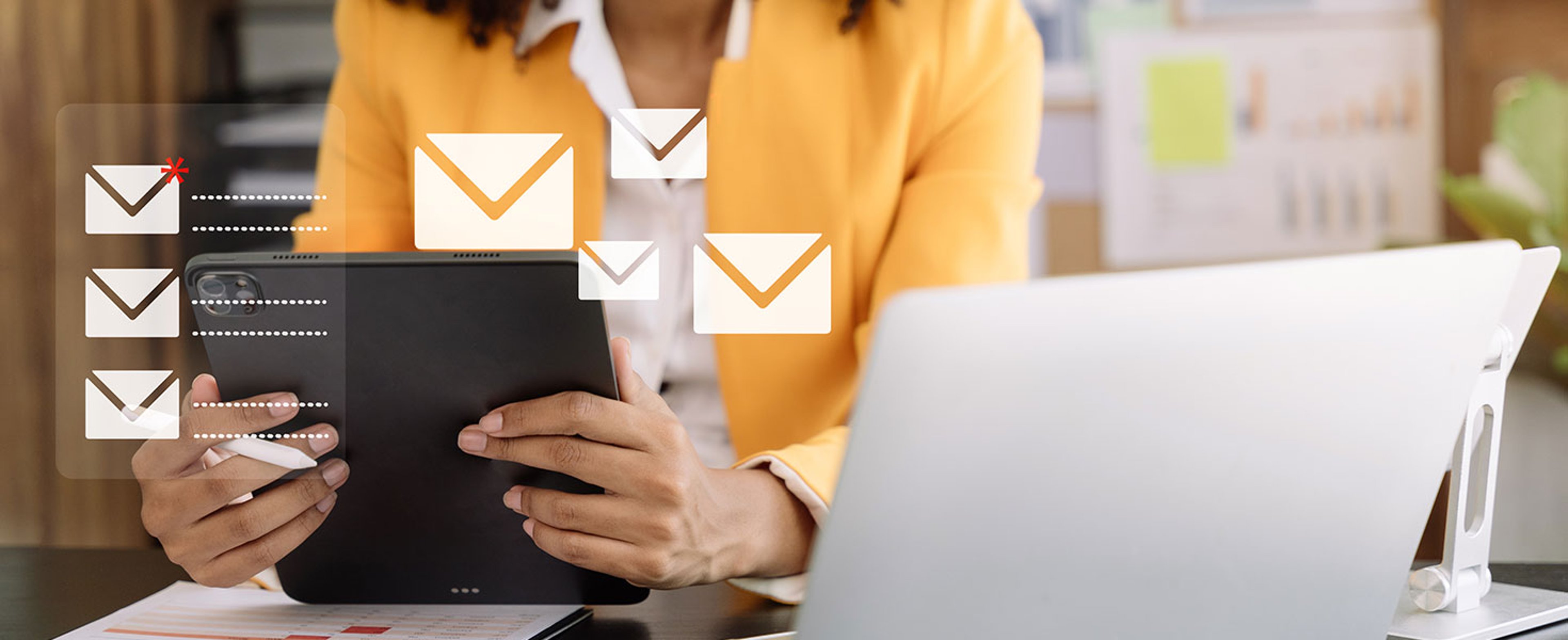 Business email marketing notification concept, Businesswoman use tablet and laptop receive message alert in the mailbox and transfer data at office. Thicha Satapitanon